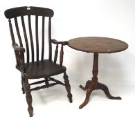A 19th century mahogany tilt top table and an elm seated armchair,