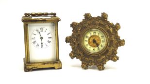 A late 19th/early 20th century French brass cased carriage clock and another smalll travel clock,