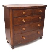 An early 20th century mahogany veneered chest of two short over three long drawers,