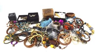 An assortment of costume jewellery, including brooches, pendants, rings,