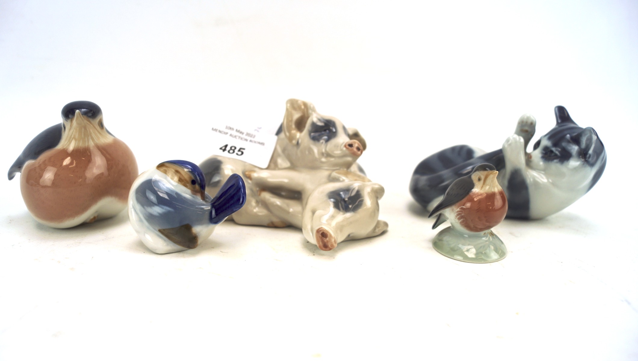 Five Royal Copenhagen ceramic animal figures, comprising a cat, three birds and a pig,