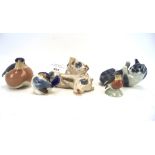 Five Royal Copenhagen ceramic animal figures, comprising a cat, three birds and a pig,