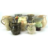 An assortment of ceramic jugs, including examples by Arthur Wood, Staffordshire, Royal Doulton, etc,