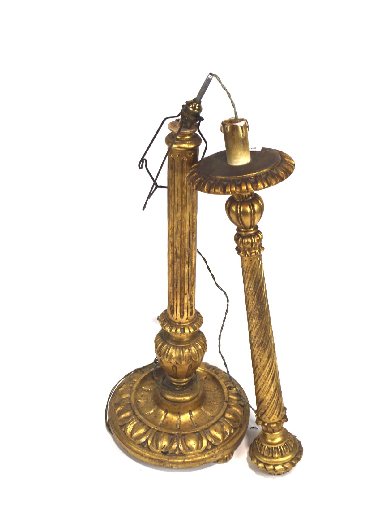 A gilt wood two part standard lamp with fluted support and on a round base carved with leaves,