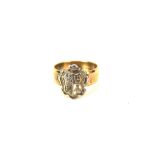 A 9ct gold child's ring, featuring a white metal coat of arms, 2.