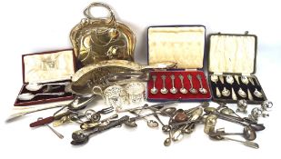 An assortment of silver plate, including cased spoons,