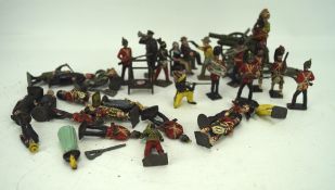 An assortment of leaded toy figures, including painted soldiers,