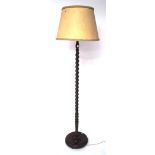 An oak barley twist standard lamp, with shade,