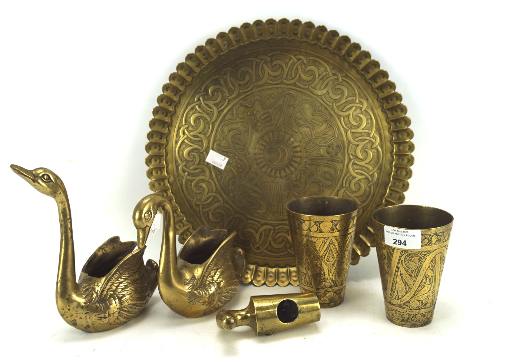 Assorted brassware, including a Middle Eastern embossed tray and two similar beakers,