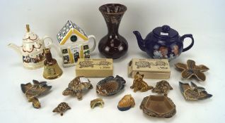 An assortment of Wade ceramics, including tortoises, a train station teapot,