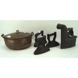 A copper bowl and four flat irons, the lidded bowl with a handle to the top and to either side,