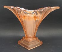 An Art deco style peach coloured glass trumpet flower vase, with interior stem holder,