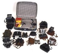 An assortment of cameras and binoculars, including Ilford sportsman,