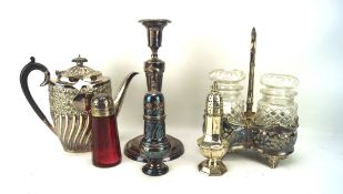 An asortment of silver plate, including a candlestick, three casters, a teapot,