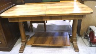A 20th century beech extendable refectory table, with curved edges,