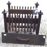 An early 20th century cast iron fire grate,