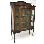An Edwardian inlaid mahogany display cabinet, containing two shelves,
