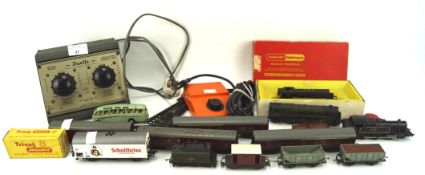 An assortment of model trains and related wares, including a Tri-ang locomotive, a boxed Hornby R.