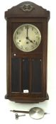 An early 20th century mahogany cased wall clock, silvered dial with Arabic numerals,