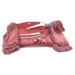 A pair of pink velvet curtains and four matching cushion covers,