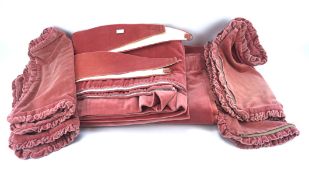 A pair of pink velvet curtains and four matching cushion covers,