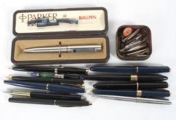 A collection of vintage fountain pens, most being Parkers,