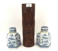 A pair of Chinese style blue and white ceramic tea caddies and a bamboo brushpot,