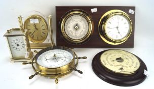 An assortment of contemporary barometers and clocks, including a brass Minster carriage clock,