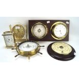 An assortment of contemporary barometers and clocks, including a brass Minster carriage clock,