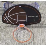 A Bee-Ball basketball hoop and a small metal-framed goal