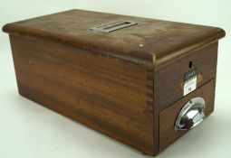 A vintage 'Adsit' wooden shop till, containing a receipt roll and bell,