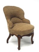 An upholstered nursery chair, with front carved mahogany cabriole supports,