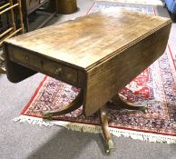 A Victorian mahogany drop leaf dining table, with rounded corners,