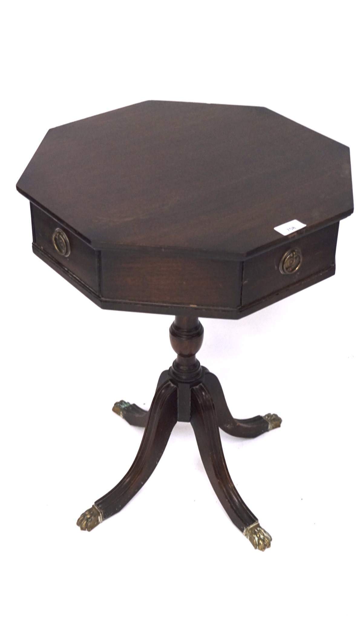 A Regency style mahogany wine table, the octagonal top with two drawers and two doors,