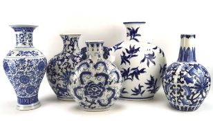Five contemporary blue and white Chinese ceramic vases, including three moon flasks,