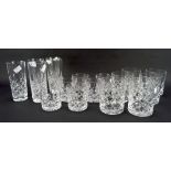 Matching cut glass drinking glasses of three sizes including whisky tumblers, a smaller example,