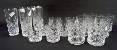 Matching cut glass drinking glasses of three sizes including whisky tumblers, a smaller example,