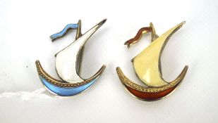 Two vintage Norweigan silver David Anderson enamel brooches, in the form of sailing boats,