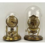 Two vintage anniversary clocks, one being by Kundo, both with glass domes,