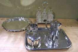 An assortment of silver plate, including a six bottle condiment set,