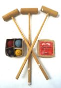 Three Jacques croquet mallets and a boxed set of four Jacques balls,