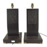 A pair of Chinese 1950s chair seat back lamp bases, painted black,
