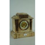 A late 19th/early 20th century marble mantel clock, the dial with Arabic numerals denoting hours,