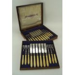 A late 19th ivory handled silver plated canteen of cutlery, forks and knives,
