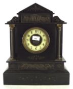 A Victorian slate mantle clock, of architectural form, with Arabic numerals on an ivorine dial,