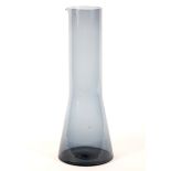 A Scandinavian glass pouring vessel, charcoal in colour,