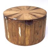 A contemporary pine coffee table storage box, of circular form,