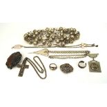 A collection of white metal jewellery, including brooches, a pendant, rings, a necklace,