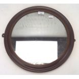 A 19th century mahogany framed wall mirror, of circular form,