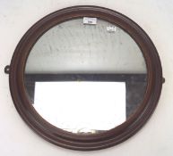 A 19th century mahogany framed wall mirror, of circular form,